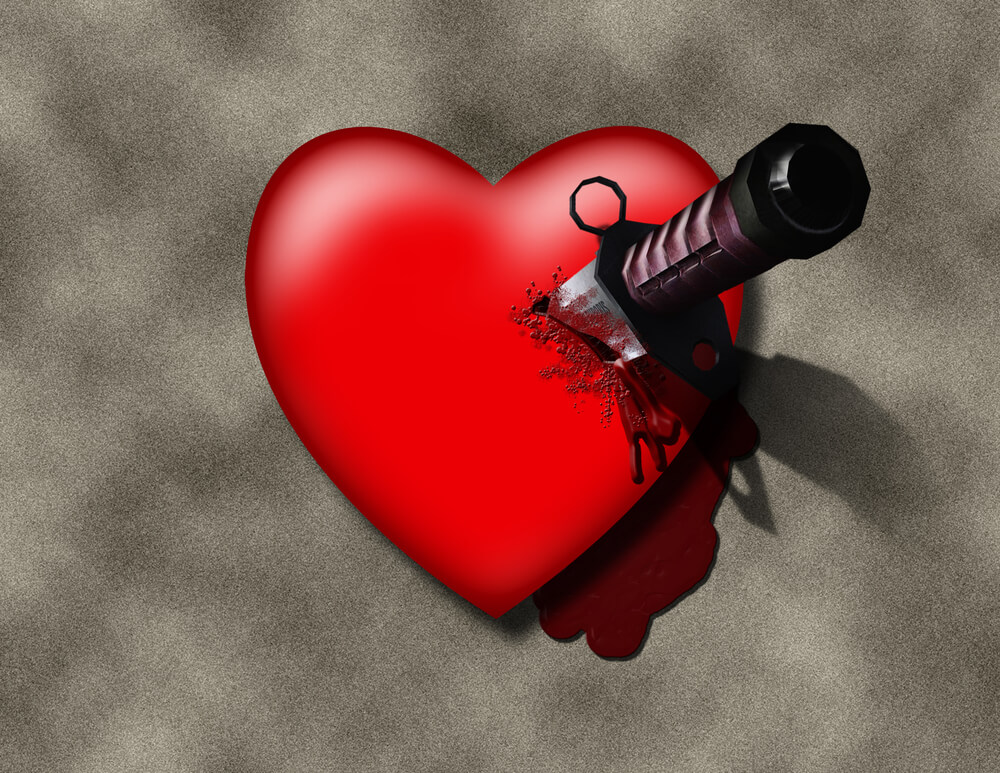 Cartoon of  a beautiful 3-D red heart, with a serious knife imbedded.