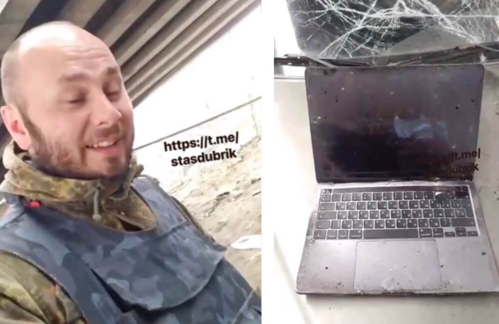 A banged
up macbook and a Ukraine soldier having a good laugh.