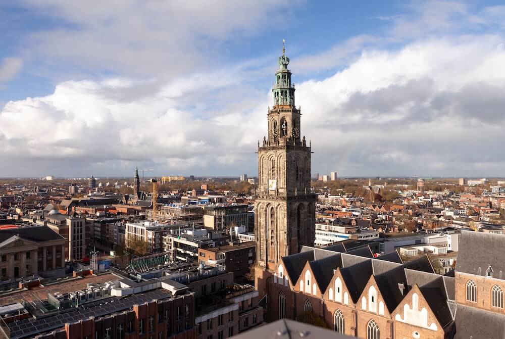 An
expansive city view with Martinitower, Netherlands, thrusting into the
sky.